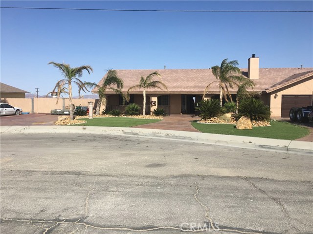 1021 Madrona Drive Barstow, California Custom built home. 4 bedrooms, 2.5 bath. Open floor plan with living room, wood burning stove, dining room, kitchen, ceramic tile flooring throughout, laundry room has cabinets, shy of .5 acre lot.
