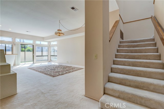 Downstairs family room that leads to the backyard