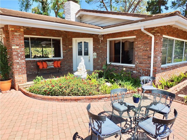 An inviting entrance to a beautiful single level traditional style home