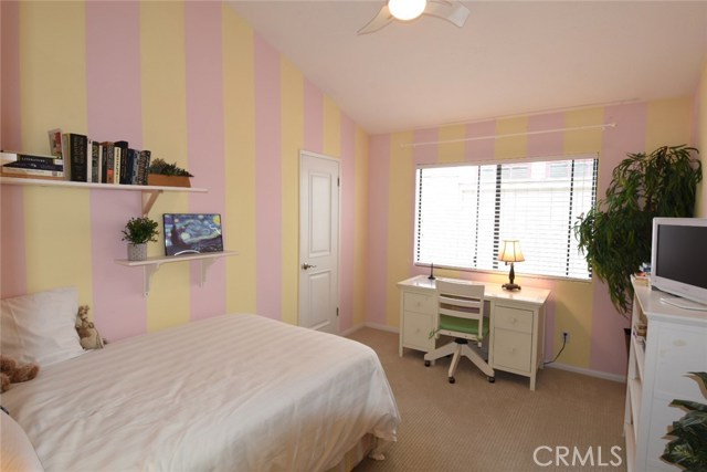 Bedroom #2 (middle) also has tall cathedral ceilings and walk-in closet.