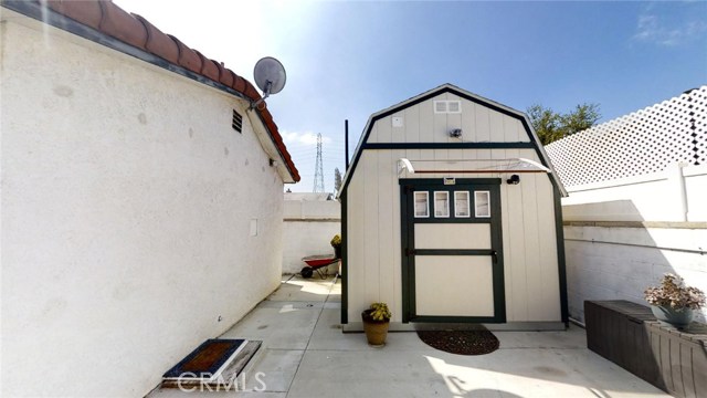 Don't miss this awesome shed perfect for a play room! It's adorable inside!