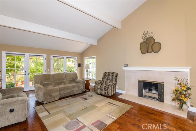 Great room with gas fireplace and access to front courtyard
