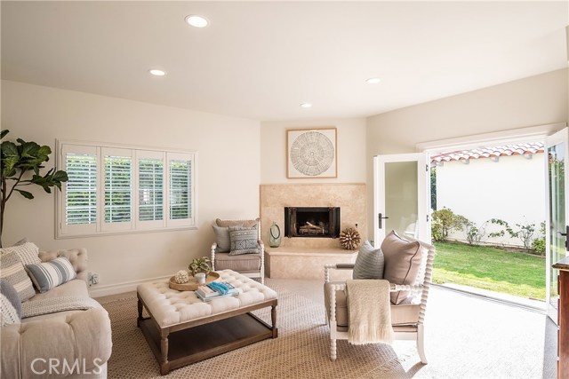 Sunny family room with French doors open to south-facing backyard