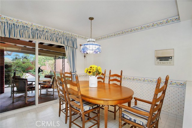 Spacious Nook with seating for 6+ opens to covered patio with another dual pane slider