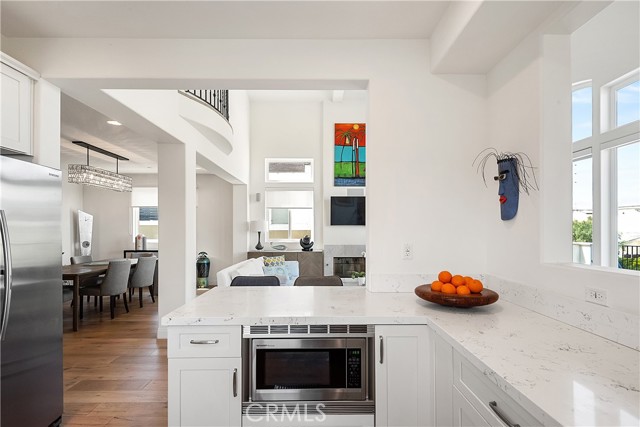 The kitchen opens up to the living and dining areas