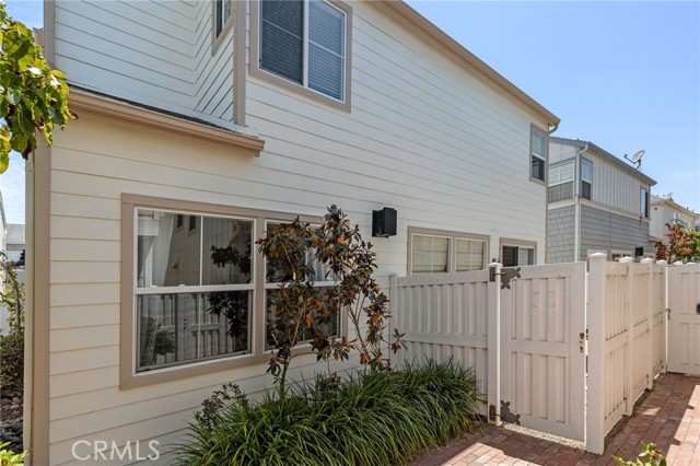Private gated entry to back patio yard