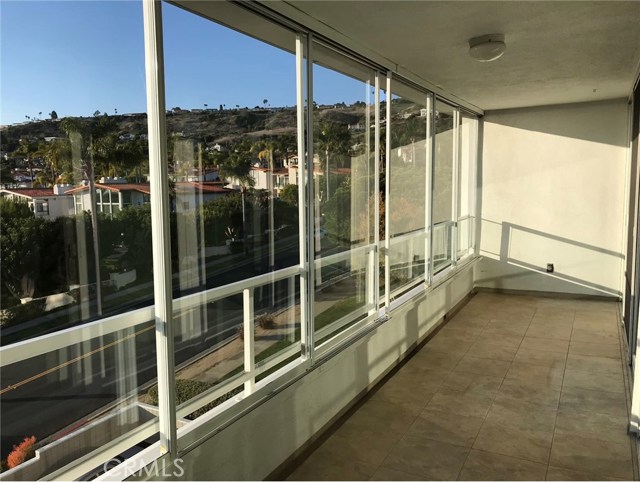 Balcony off of bedrooms with sliding panes