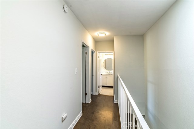 Light filled hallway leads to secondary bedrooms and additional bathroom.