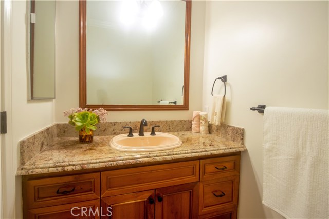 Half bath near the laundry room and kitchen