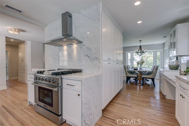 Commanding Kitchen, Ample Cabinetry, Open to Dining Room