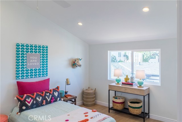 The slanted ceiling in this bedroom create charm and endless decorating options.