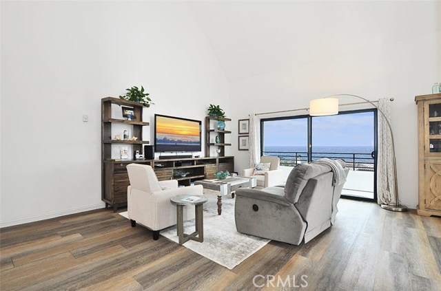 Living room with soaring ceilings and an ocean view