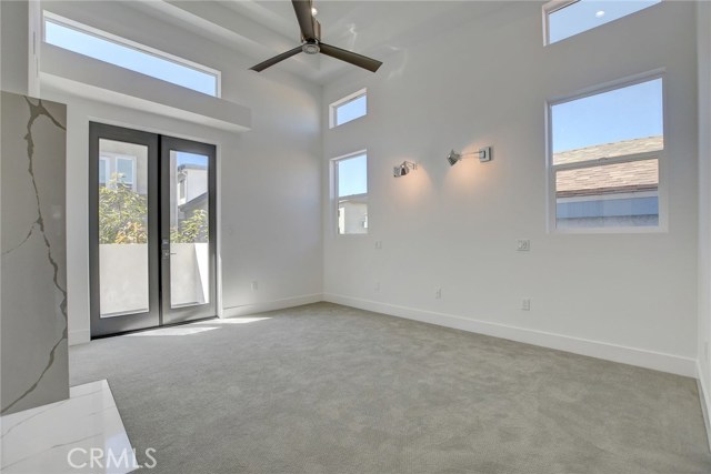 2nd Level . . . Master Bedroom with ceiling fan, dual reading lamps and smart plugs.