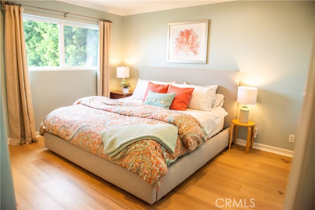 Bedroom #2 with French Oak hardwood floors shares a Jack-n-Jill bathroom with bedroom #3.