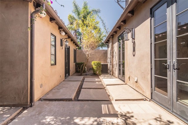 Main home on the right with detached casita/executive office/studio on the left