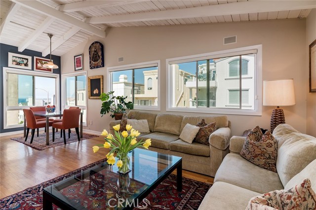 Living and dining areas...hardwood floors...all these huge windows can only mean one thing...views for days. Oh and lots of sun too.