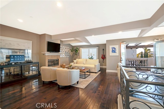 Open floorplan living space and ocean view balcony