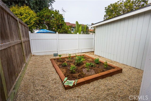 GARDEN BED BEHIND GARAGE PERFECT FOR YOUR ORGANIC VEGGIES, FRUITS, AND HERBS!