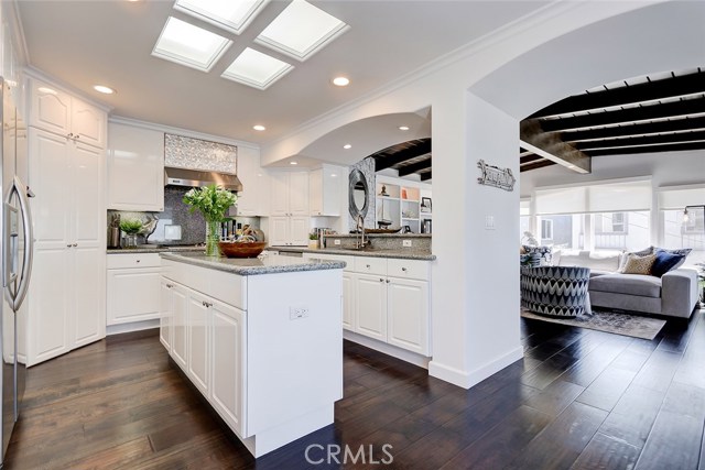 Remodeled Chef's Gourmet Kitchen with Center Island, Granite Countertops, & Stainless Steel Viking and Kitchen Aid Appliances.