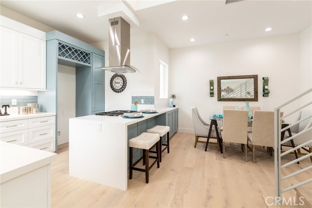Stylish kitchen with breakfast bar and dining area