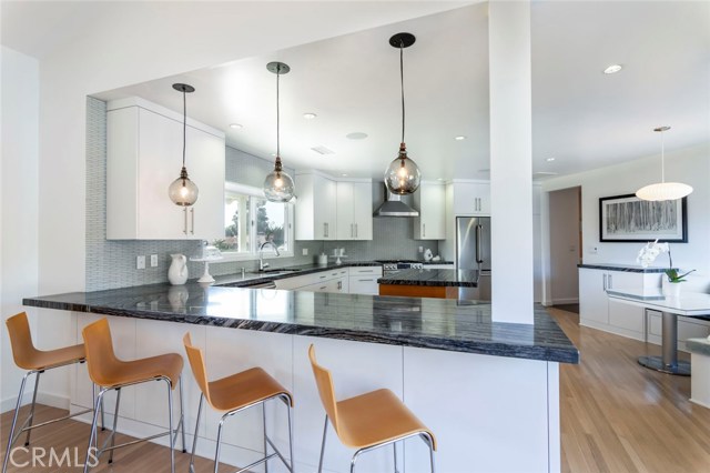 A kitchen to be envied by all. Something for everyone's daily to-do's to entertaining the finest dinner party, this kitchen would be a centerpiece in any home and a must-have.