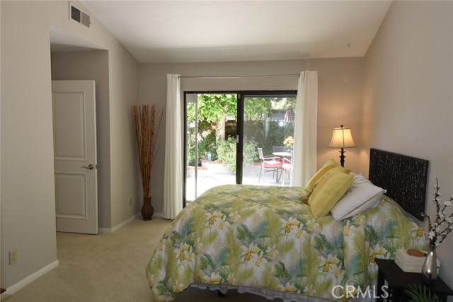 Another view of the 3rd bedroom with slider to the rear yard.