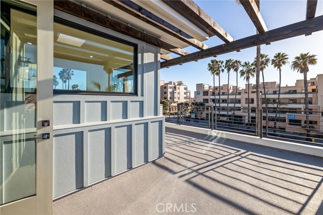 French doors lead from the loft to the spacious veranda