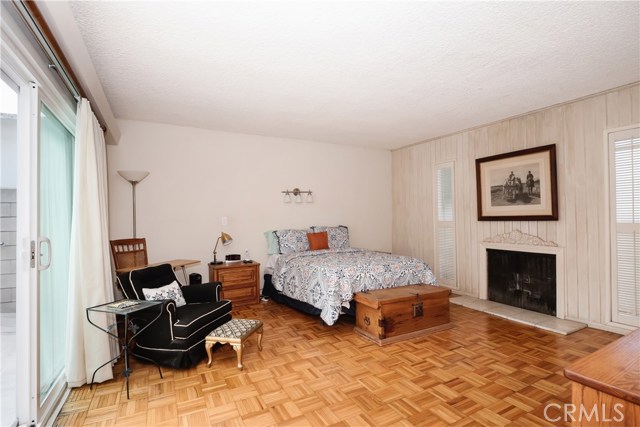 large bedroom downstairs with fireplace