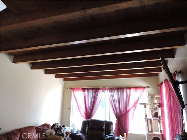 Wood paneled and beamed ceiling!