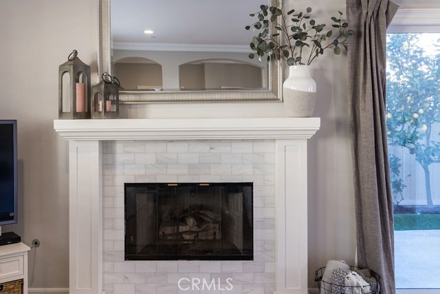 Carrera marble tiled fireplace