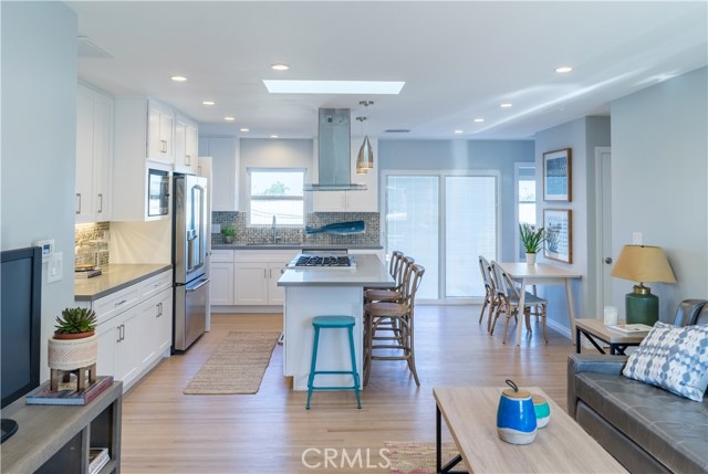 The open floor plan allows open conversation and flow from the living area to the kitchen.