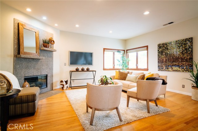 Living room with fireplace and hardwood floors