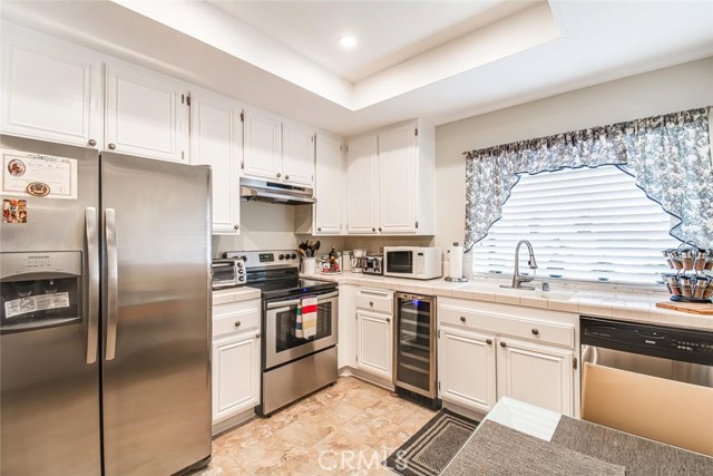 Nice and bright kitchen with brand new Stainless Steel appliances including a wine refrigerator