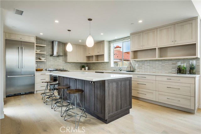 Custom cabinets, 5 Burner Stove, Microwave located within Center Islad