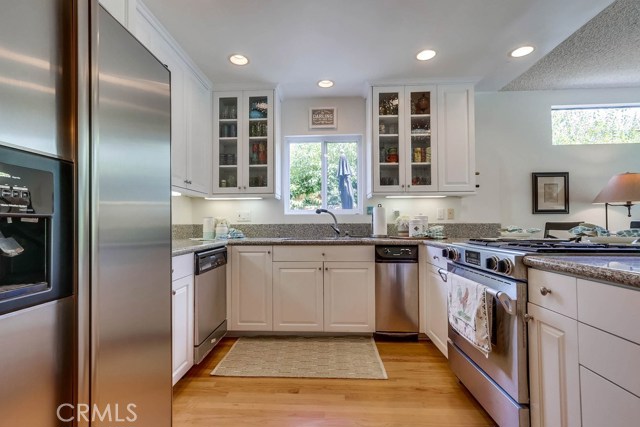 Great remodeled kitchen with showcase cabinets and stainless appliances