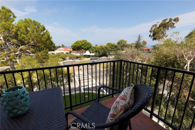 Balcony with peek-a-boo ocean view looks out onto Lunada Bay Plaza.