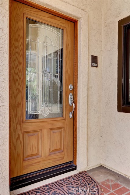 Front entry with beautiful leaded glass detail.