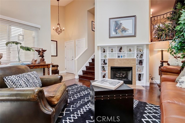 High ceilings, recessed lighting, and entry way chandelier add sophistication and elegance to this open space.