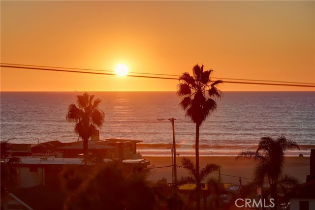 Enjoy unblock-able white water, panoramic ocean and Sunset views from entire future great room level.   This shot is zoomed in some.