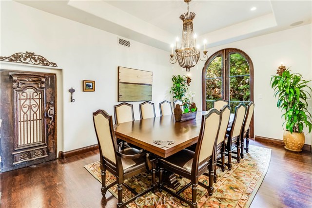 Large Dining room with door to wine/storage area