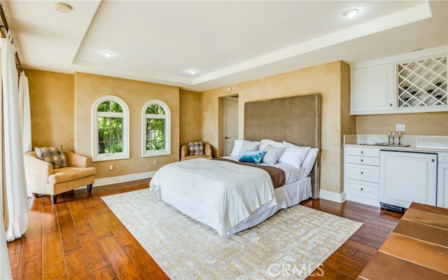 Bed in guest house with wet bar, fireplace and 3/4 bath.