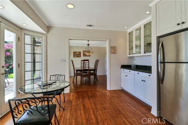 Eating area off of the kitchen leading out to the backyard through French doors