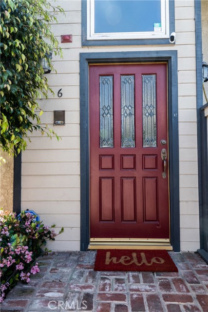 Charming and private front entrance to this end unit home