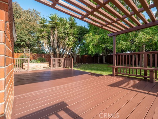 The expansive wood deck is perfect for entertaining and relaxing overlooking the huge yard.