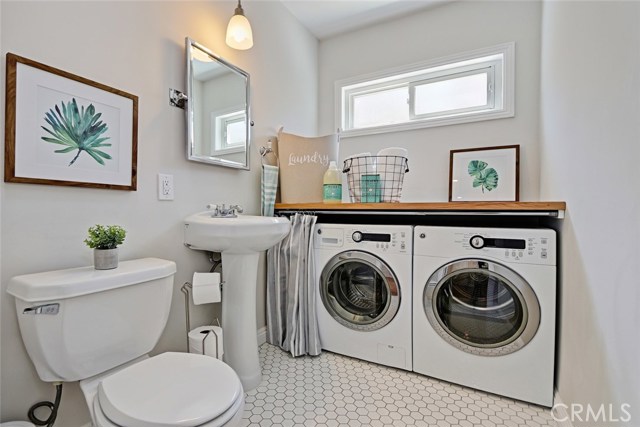 A combo powder room/laundry area.