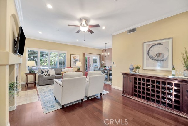 Wonderful Open Floorplan, Living room with Fireplace, Crown Molding, Walnut Hardwood Floors, Double Paned Windows, Plantation Shutters throughout Wonderful Open Floorplan, Living room with Fireplace, Crown Molding, Walnut Hardwood Floors, Double Paned Windows, Plantation Shutters throughout