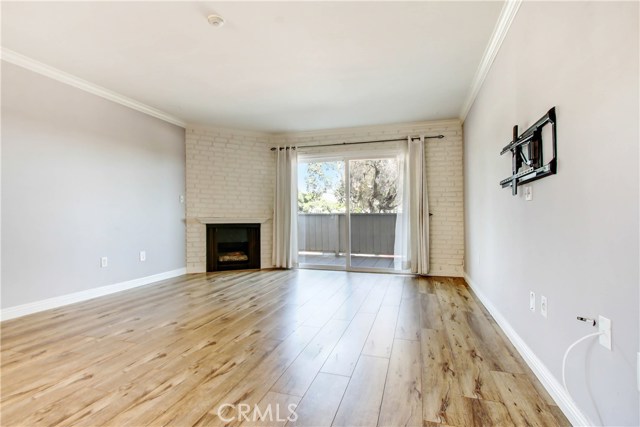 OPEN AND BRIGHT, LAMINATE FLOORING & CROWN MOLDING. WALK THRU SLIDING DOORS TO A SPACIOUS PATIO AREA OPEN AND BRIGHT, LAMINATE FLOORING & CROWN MOLDING. WALK THRU SLIDING DOORS TO A SPACIOUS PATIO AREA