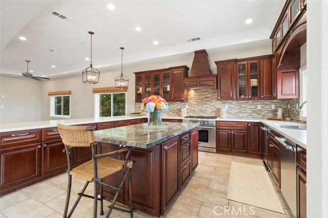 Open kitchen with island and lots of cabinet storage space.