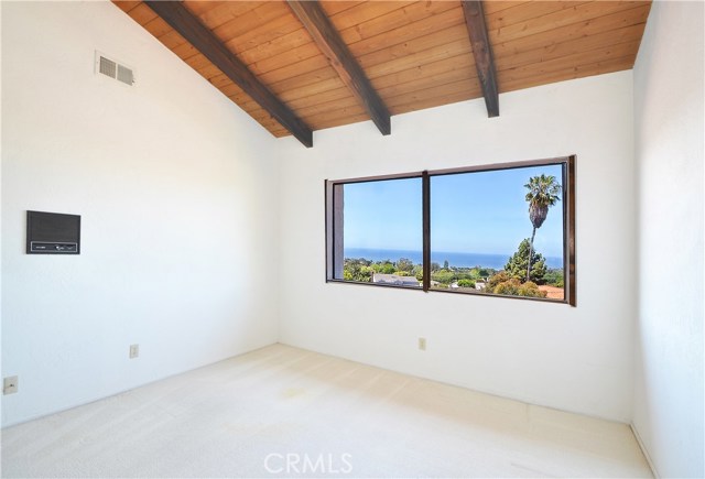 Bedroom 3 with ocean views and vaulted ceilings