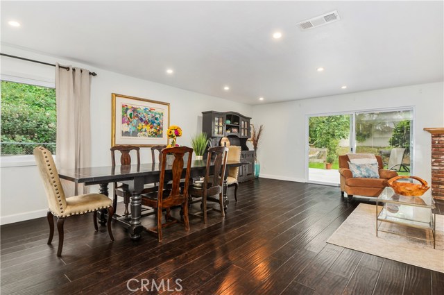 Open floor plan layout connects dining room, kitchen and family room. Open floor plan layout connects dining room, kitchen and family room.
